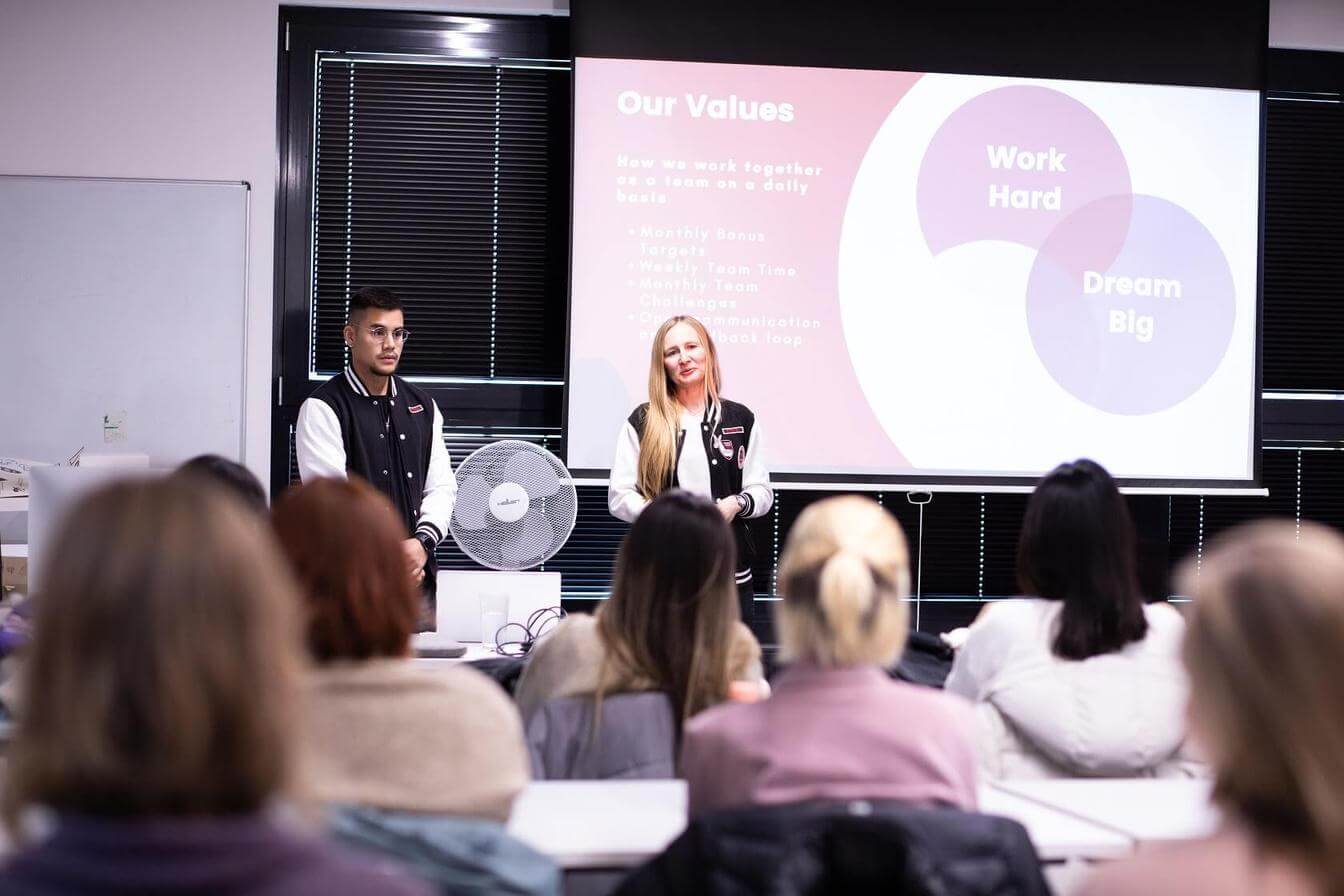 a group of people representing slides to people