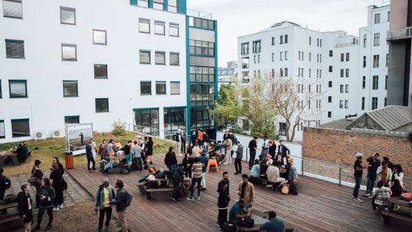 terrace of ue campus berlin full with a lot of people