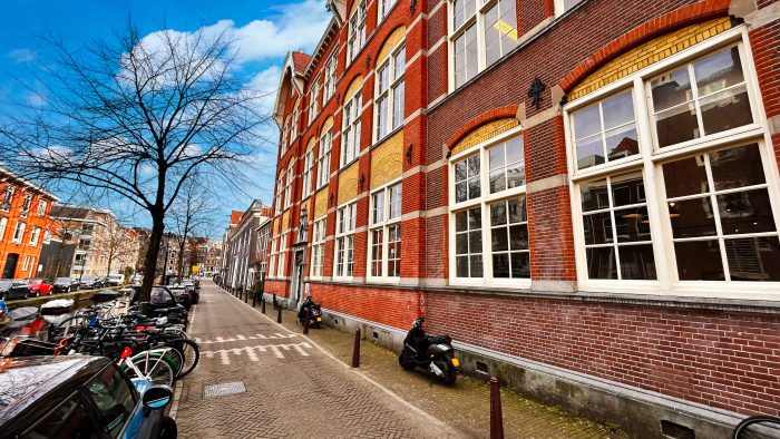 a front of a red brick building